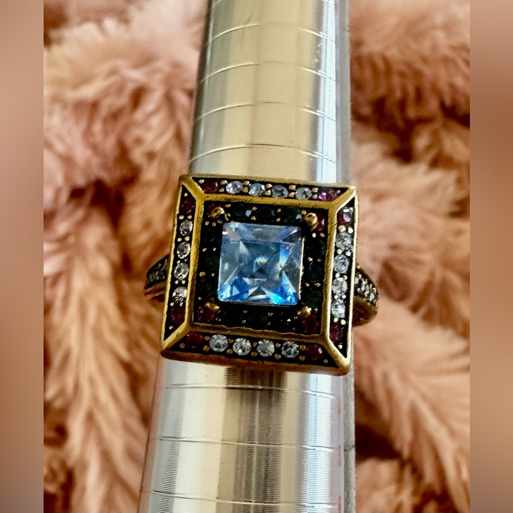 Heidi Daus cocktail ring in antique gold colored metal with Swarovski crystals.